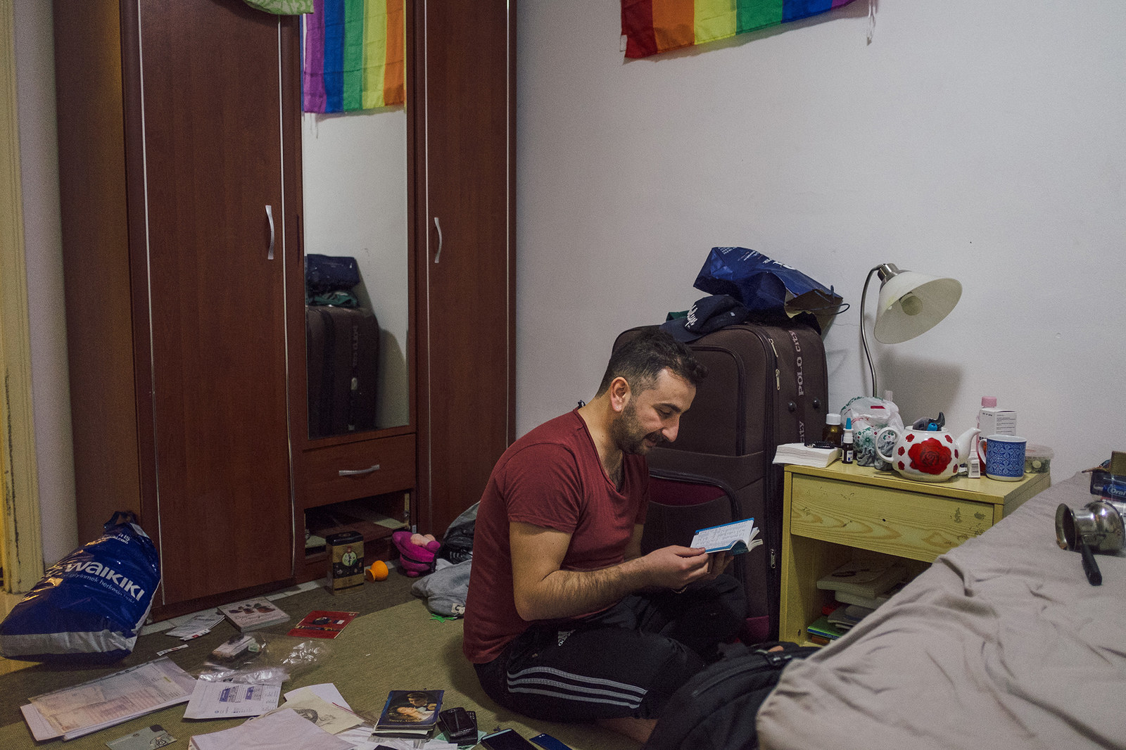 While packing, it's difficult for Nader not to think of what he'll be leaving behind: his job, his friends, and his fiancé.