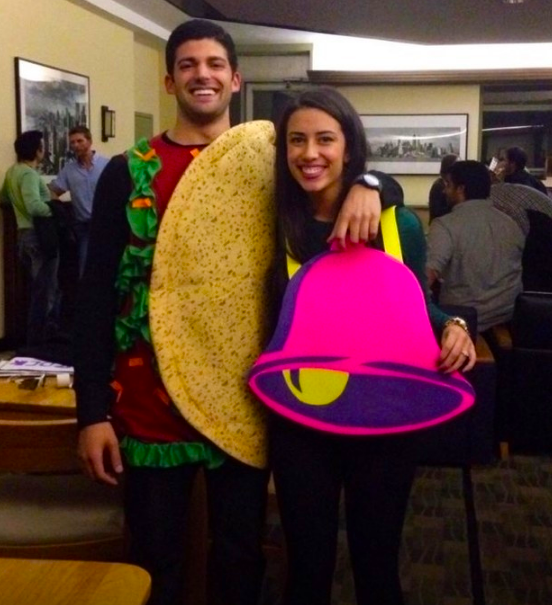 One person dressed as a taco and one person dressed as a purple bell