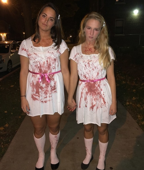 Two girls in white bloody dresses