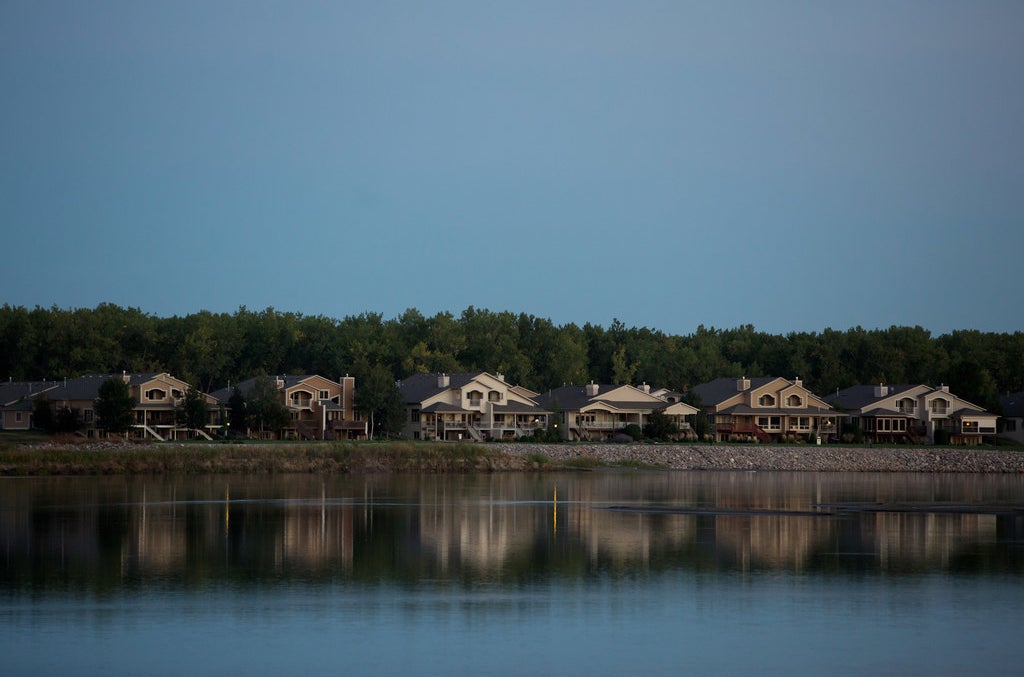 Large houses along the Missouri River in Bismarck, North Dakota.