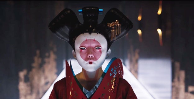 The first trailer features a masked woman, donning geisha neck make up, walking down an ominously lit corridor in a futuristic kimono.