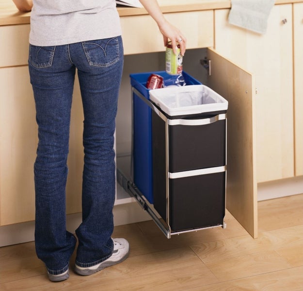 Stash your trash and recycling beneath the counter with a rolling system.
