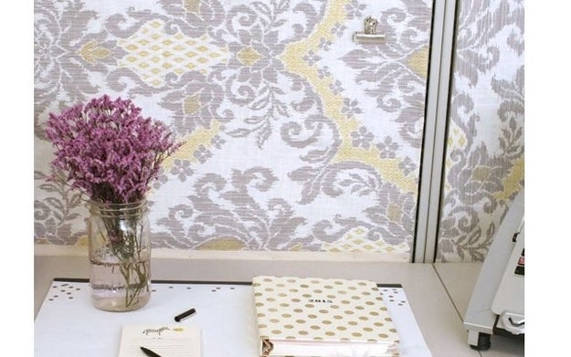 Tack fabric to your partition walls to get the look of fancy wallpaper.