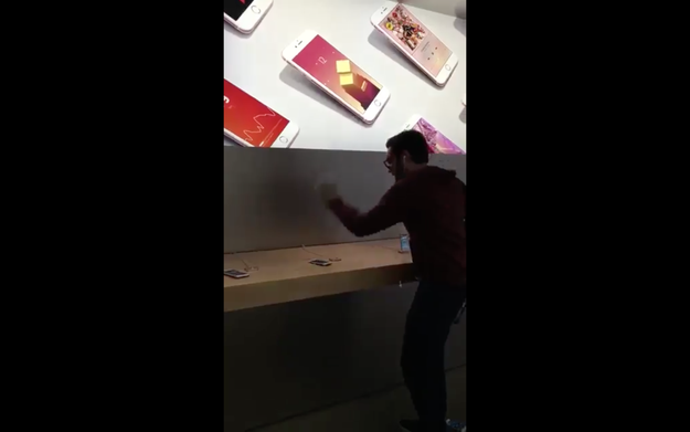 In a video filmed by a bystander, the man yells that his rights as a consumer had been violated by Apple.