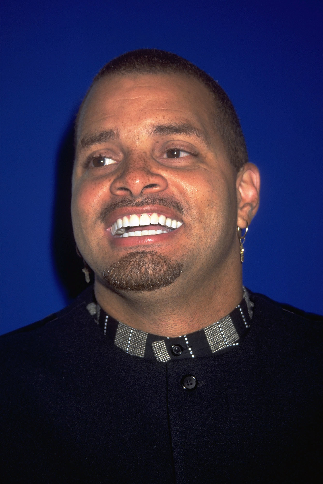 Sinbad smiles at an event