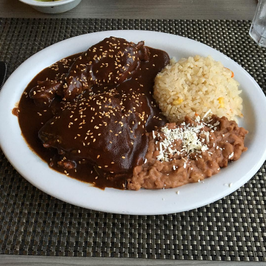 If you don't know about mole, it's essentially a sauce made up of spices, chiles, and chocolate that gets poured over meat.