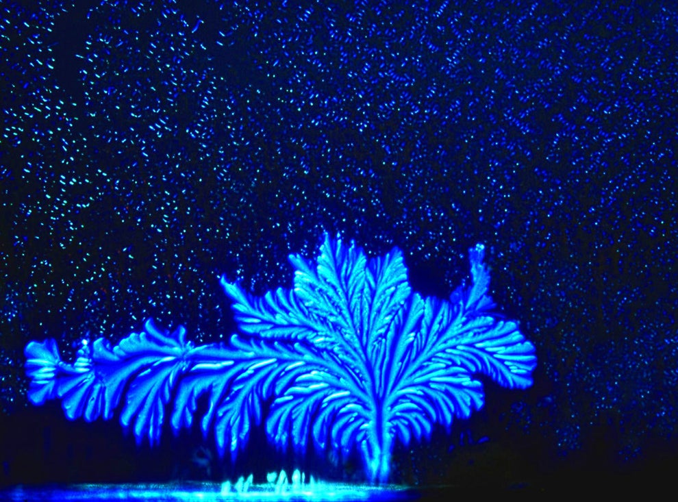 Sugar crystals appearing like a surreal scene under a night sky.