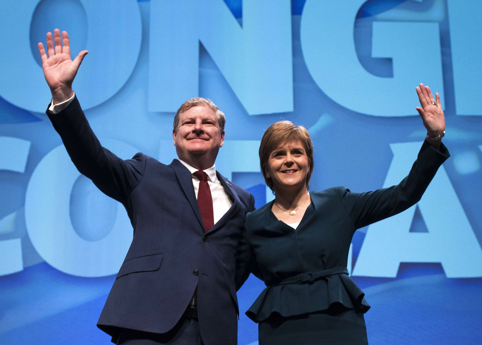 First minister and leader of the Scottish National Party Nicola Sturgeon on stage with the new deputy leader, Angus Robertson, at the party's biggest-ever conference in Glasgow.