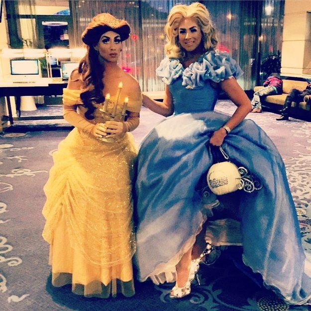 One person in a yellow princess dress and one person in a blue princess dress