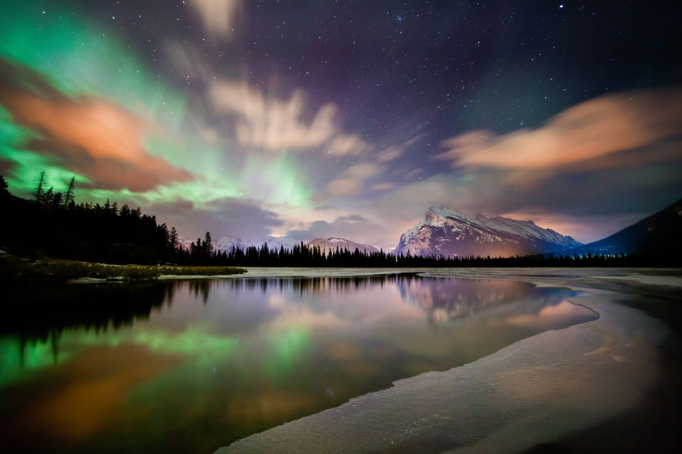 Look up in awe of the aurora borealis.