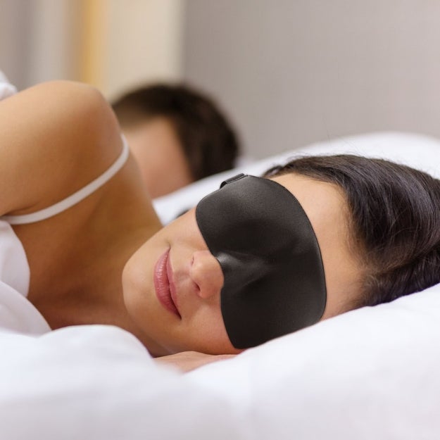 Keep a contoured sleep mask on your bedside table so you'll look post-vacay rested.