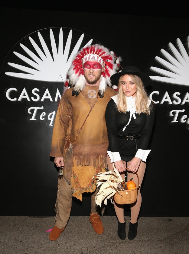 And she brought along her boyfriend, trainer Jason Walsh, who dressed up as...a Native American.