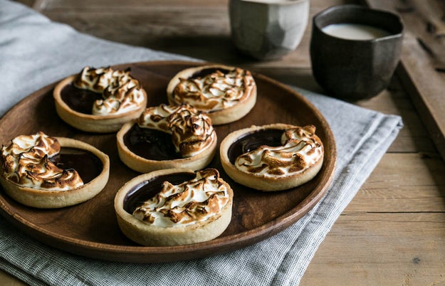 Pull out your kitchen torch and toast some marshmallow topping for a beautiful, finishing flourish to your s'mores tarts.