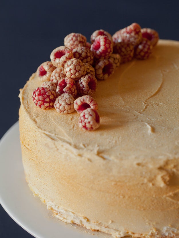 Sprinkle a shit ton of edible gold glitter on your cake (and coat your raspberries with it too) for a magical, regal effect.