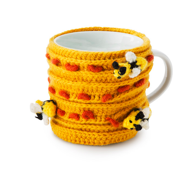 A honey hive mug hugger that's perfect for your morning buzz.