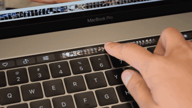 The Touch Bar is so slick and smooth, it feels frictionless. It’s a virtualization of the keys you’d typically find at the top of the keyboard, with some more bells and whistles. The whole gang’s still there: the ESC key, music controls, volume control, the Launchpad shortcut that I’ve literally NEVER seen anyone use, a dedicated Siri button, etc. Touch Bar can be customized in a number of ways with actions like Screenshot and Show Desktop (my favorite *hide everything* trick for when people creep up from behind). As one might expect at this early stage, the only apps with Touch Bar support right now are Apple-designed ones like Photos and Mail, and some applications make better use of Touch Bar than others. My favorite is viewing PDFs in Preview, which you can quickly highlight with a single tap. The bar also allows you to stay in full screen longer in the Photos app by placing a menu of touch-based editing tools right at your fingertips. In Final Cut Pro, you can precisely trim clips with your finger, which feels more ergonomic than using your trackpad. In QuickTime, being able to scrub videos backwards and forwards with precision is pretty sweet, too. Finger input feels easier, faster, and more precise than clicking and dragging on a trackpad. Another neat feature is that adjusting volume and brightness only requires a single swipe: Instead of multiple key taps, you can press and hold the volume icon and then move your finger back in forth to adjust.