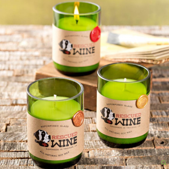 Soy candles made from wine bottles where proceeds go to nonprofit animal rescue groups.
