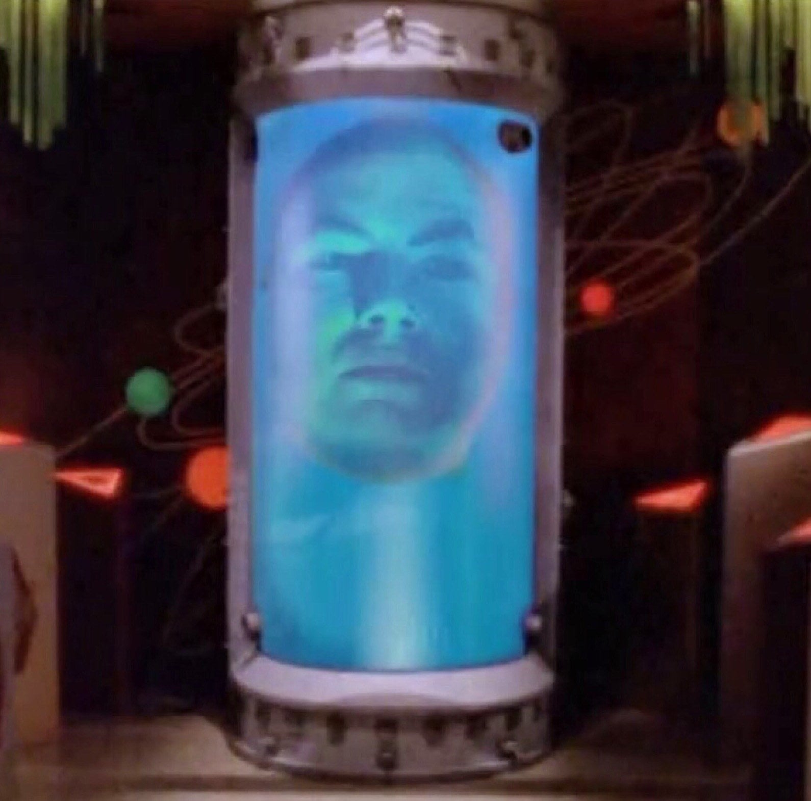 a floating head in a large vile of liquid