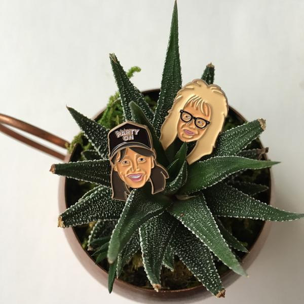 A pair of pins for besties who like to "party on."