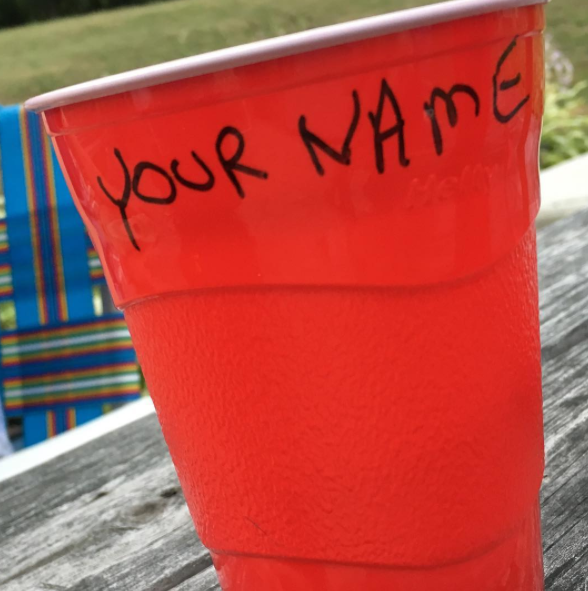 This dad who followed directions when asked to put "your name" on his cup.