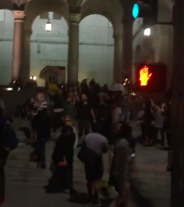 A handful of peaceful protesters chanted "We stand together" in downtown Los Angeles.