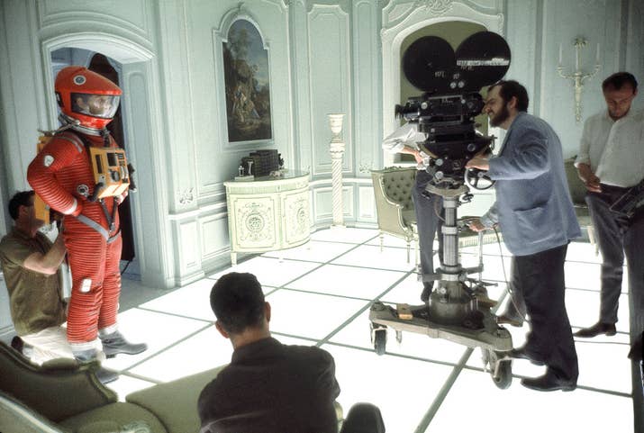 Director and screenwriter Stanley Kubrick finds his shot on the set of 2001: A Space Odyssey at the MGM British Studios in Borehamwood, England. On the left is American actor Keir Dullea in a spacesuit.