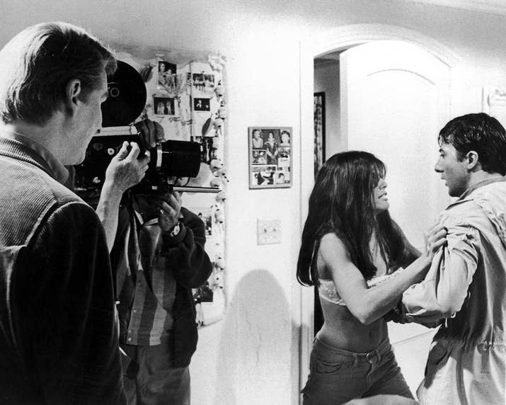 Director Mike Nichols watches as actors Katharine Ross and Dustin Hoffman act in a scene from The Graduate.