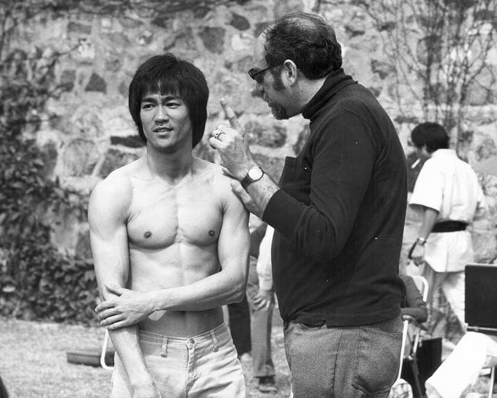 Actor Bruce Lee with producer Fred Weintraub on the set of Enter the Dragon.