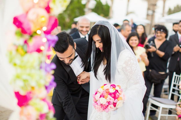 Watching him adorably adjust her dress as she stands at the altar is enough to warm the coldest hearts this winter.