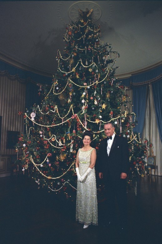 Don't get me wrong, I love a popcorn garland. But this was just not executed well. It should not look like you've TP'd your Christmas tree with cranberries and popped corn kernels. Also, I get ominous vibes from this picture. They couldn't have lit the tree so it didn't leave such a crazy shadow over half the room? And I know it's probably an even harder task, but they couldn't get LBJ to smile?