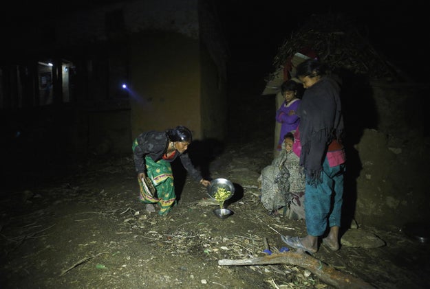 The photo below was taken in the Legudsen village in the western Accham district in 2014. It shows a family member attempting to feed women practicing chhaupadi without touching their utensils.