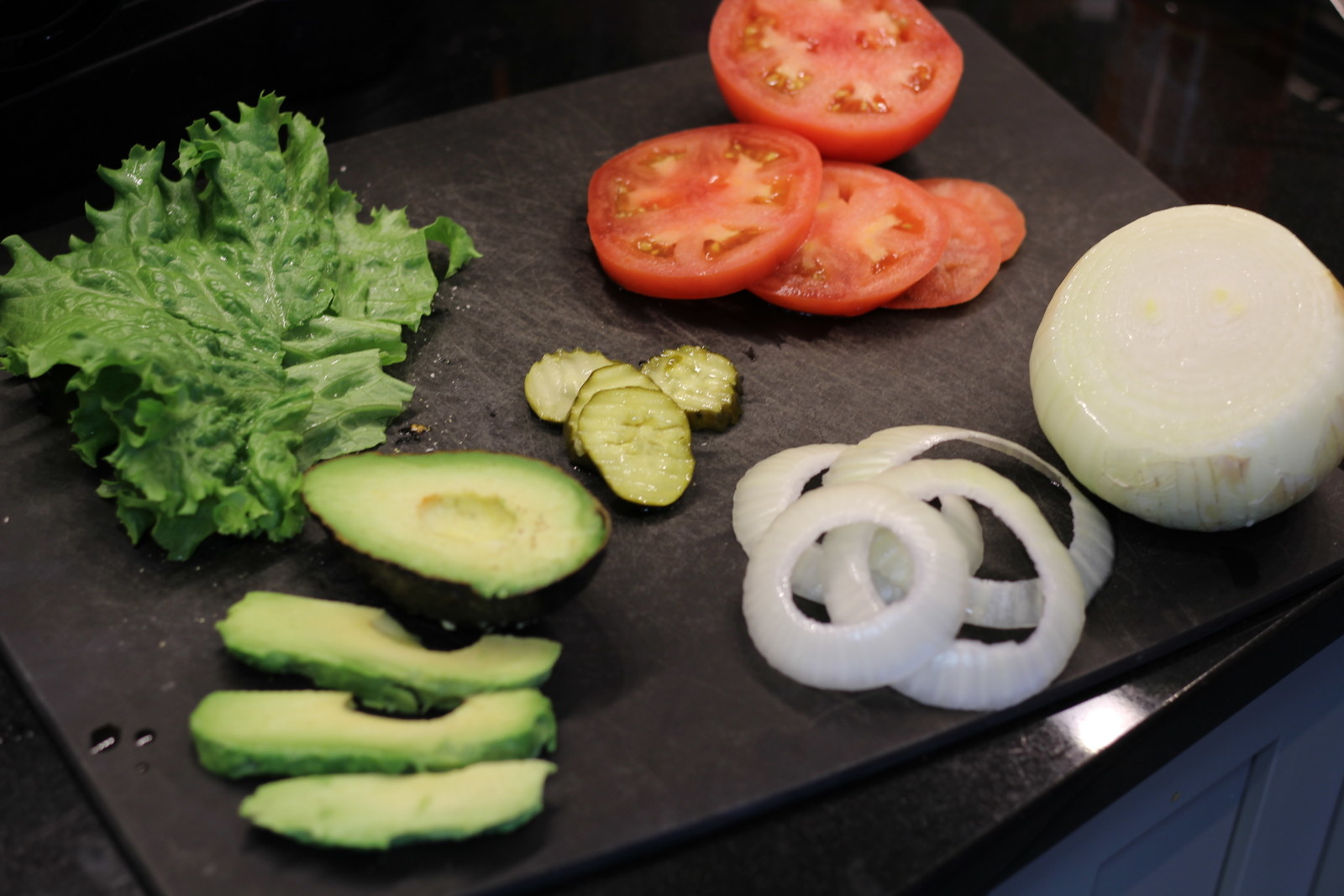Throw on your favorite burger toppings and a little more of our sriracha sauce. Go crazy. Lettuce. Tomatoes. Onions. Pickles. Avocado... because duh.