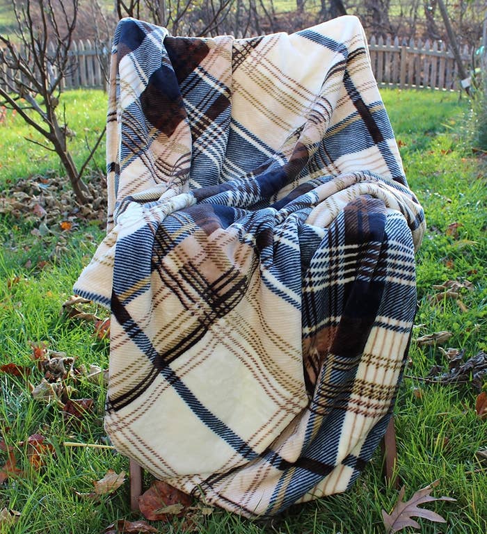 tartan plaid blanket on a chair in a yard