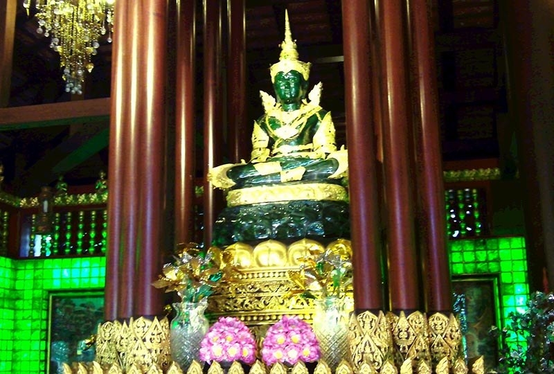 A delicate revered emerald statue of Lord Buddha located in one of the holiest temples in the city, Wat Phra Kaew.