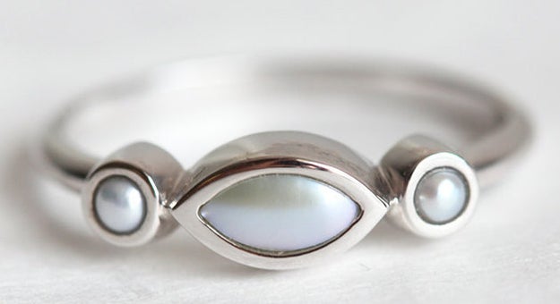 A classy marquise-shaped ring that gifts you three pearls of wisdom.