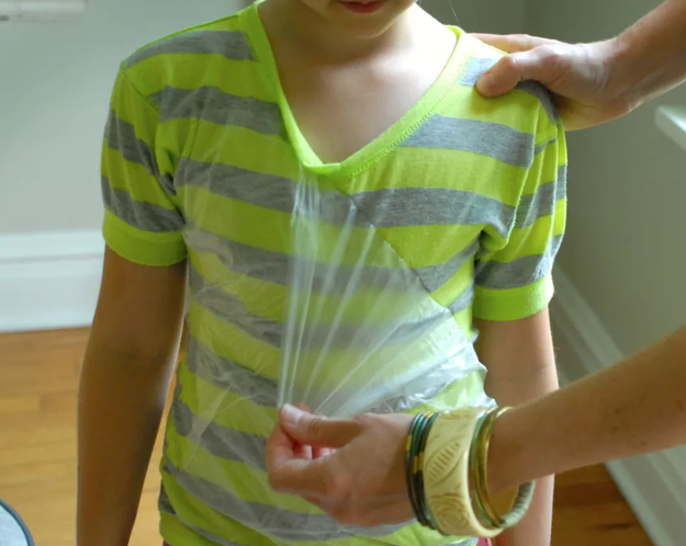 Place Press'n Seal wrap over your kid's shirt before they make a messy craft so their clothes don't get dirty.