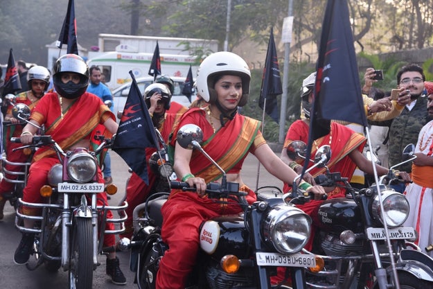 Wearing nauvari saris and biker boots.