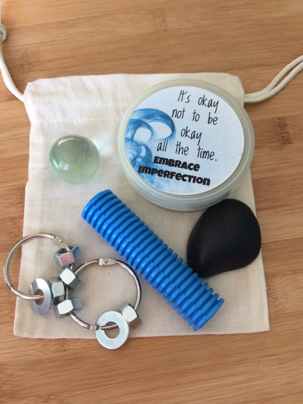A portable stim/fidget bag, perfect size to have with you on the go. Buy it here.