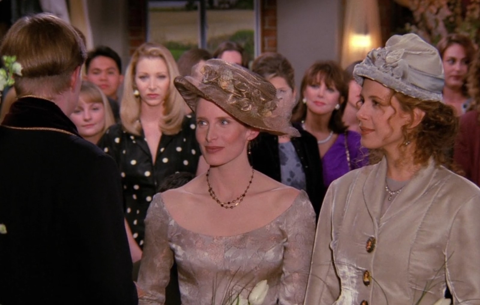 Ross's ex-wife Carol gets remarried...to a woman! Carol and Susan's wedding was the second gay marriage on a sitcom. It drew some media attention due to the fact, Candace Gingrich (Newt Gingrich's sister), a gay-rights activist, was the one officiating the wedding, shown up in the left hand corner. The episode only received four complaint phone calls, meaning that gay marriages were slowly gaining acceptance and Friends was continuously promoting these relationships with their focus on Carol and Susan. Years earlier this would have never been possible, but through our mainstream media, we can see that it's becoming more and more common.