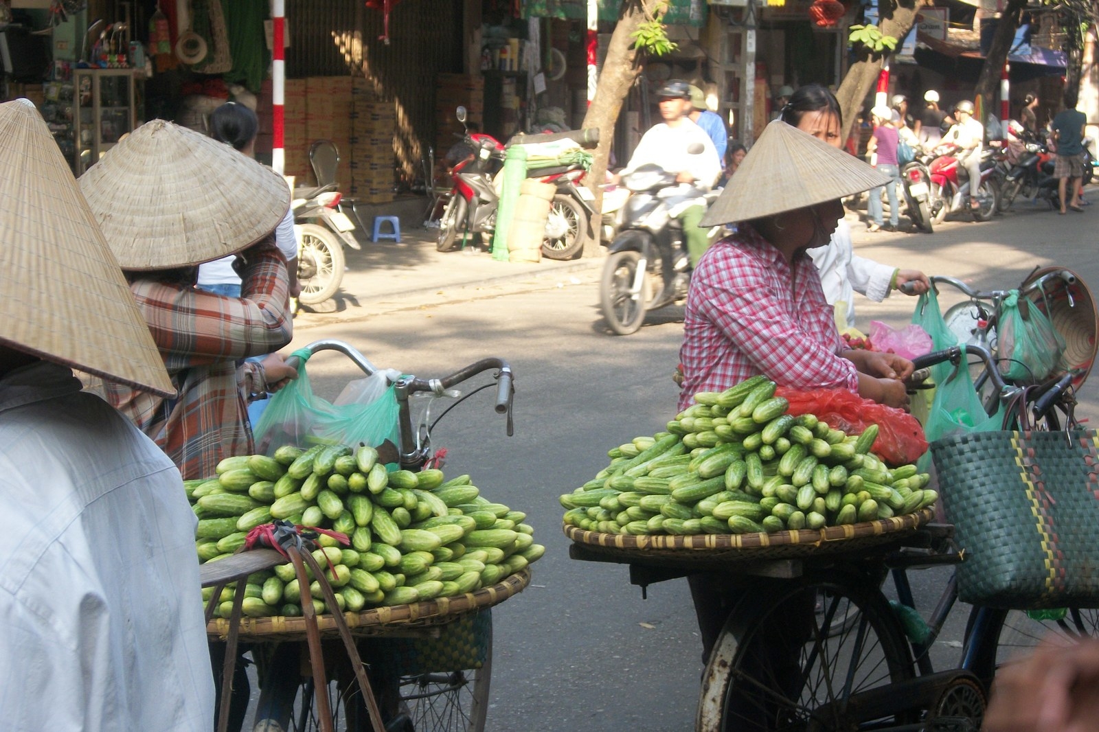 The streets of Hanoi are an adventure in themselves and without question, one of the best places in the world to people watch. Grab a $.25cent beer from a roadside bar, find yourself a plastic stool, and watch the endless amount of motorbikes zoom on by....with everything from bamboo sticks to an entire family of 6- all piled onto one bike!