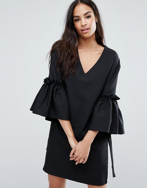 A chic LBD with exaggerated sleeves.