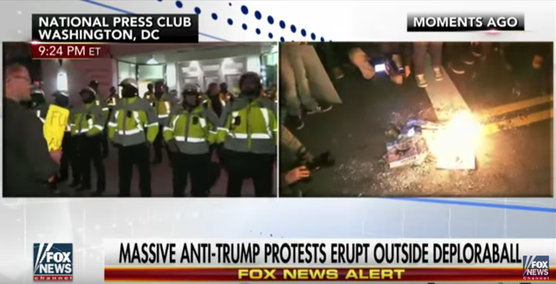 In the segment, Fox News reporter Griff Jenkins is interviewing people outside the DeploraBall — an alt-right and pro-Trump rally — where anti-Trump protests, and a small fire, had broken out.