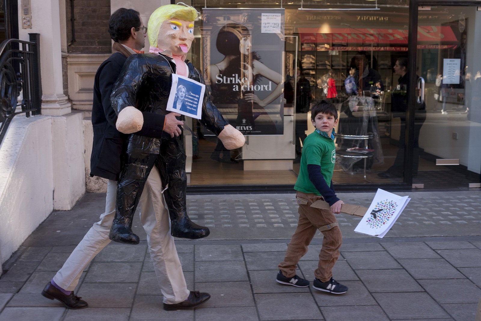 Demonstrators take part in the Women's March through central London.