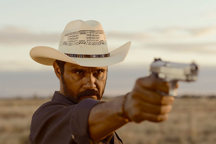 Ivan Sen's Mystery Road is an Outback-western drama starring Aaron Pedersen as an Indigenous cowboy detective who returns to his home town to solve the murder of a teenage girl. The cast also includes Hugo Weaving, Jack Thompson, and Ryan Kwanten.
