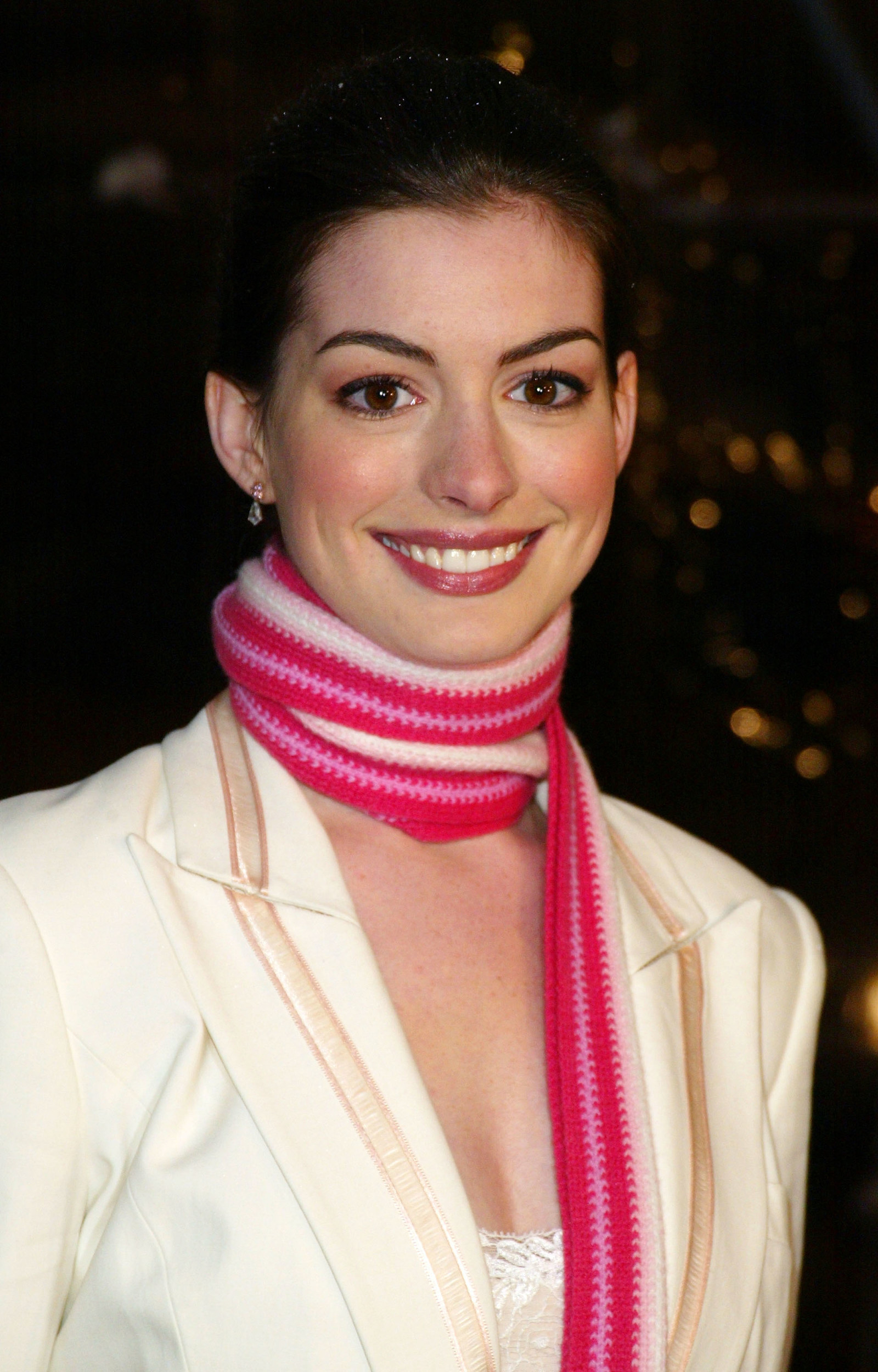 anne hathaway smiling with thin scarf