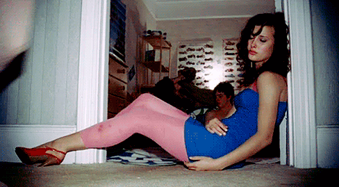 girl in footless tights against doorway