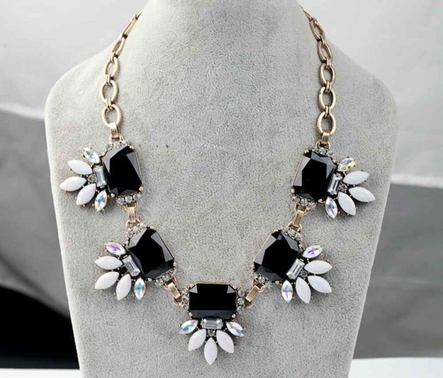 A chunky, crystal-leaf rhinestone necklace that adds the perfect polish.