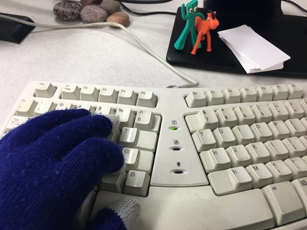 Wearing gloves while typing.