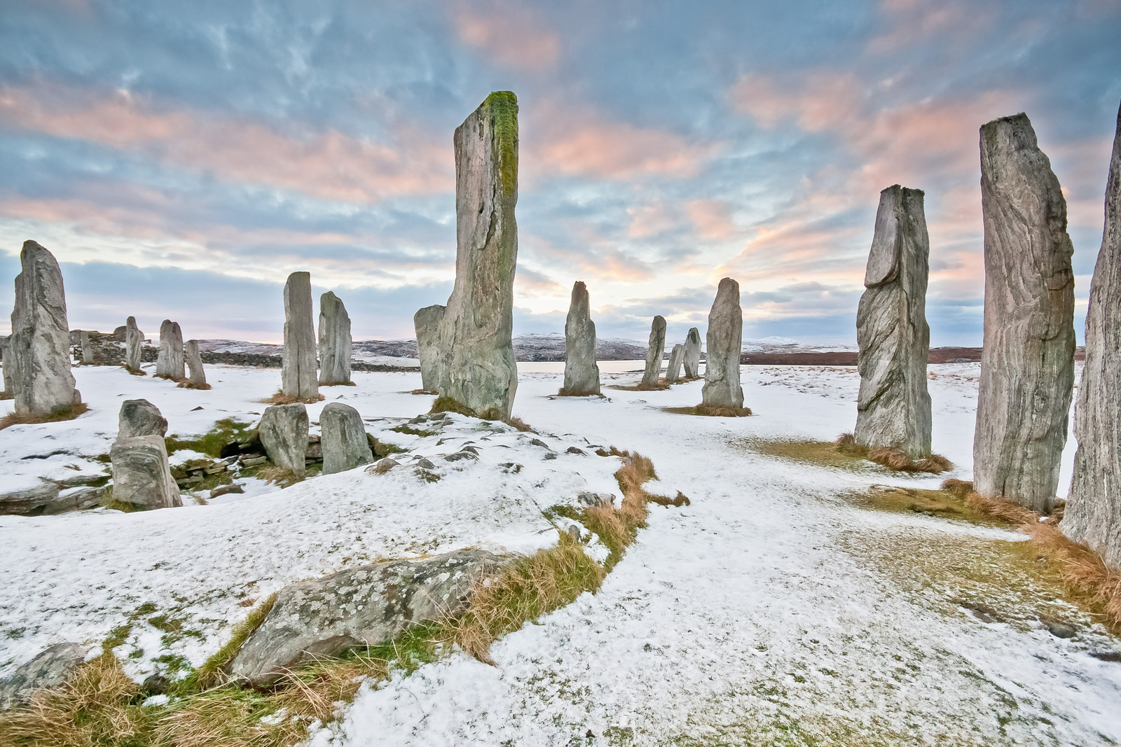 These ancient standing stones date back to the late Neolithic (new Stone Age) period. They were arranged in a cruciform shape, and were a focus for early ritual activity. They're probably also home to a tribe of friendly trolls.