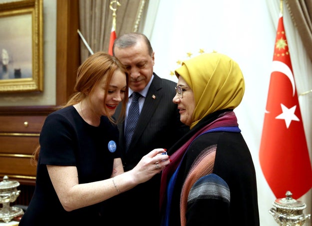 That last bit of weirdness hasn't gone away — unlike most of LiLo's Instagram pictures — as she presented President Recep Tayyip Erdogan and his wife with pins that had the slogan on it.